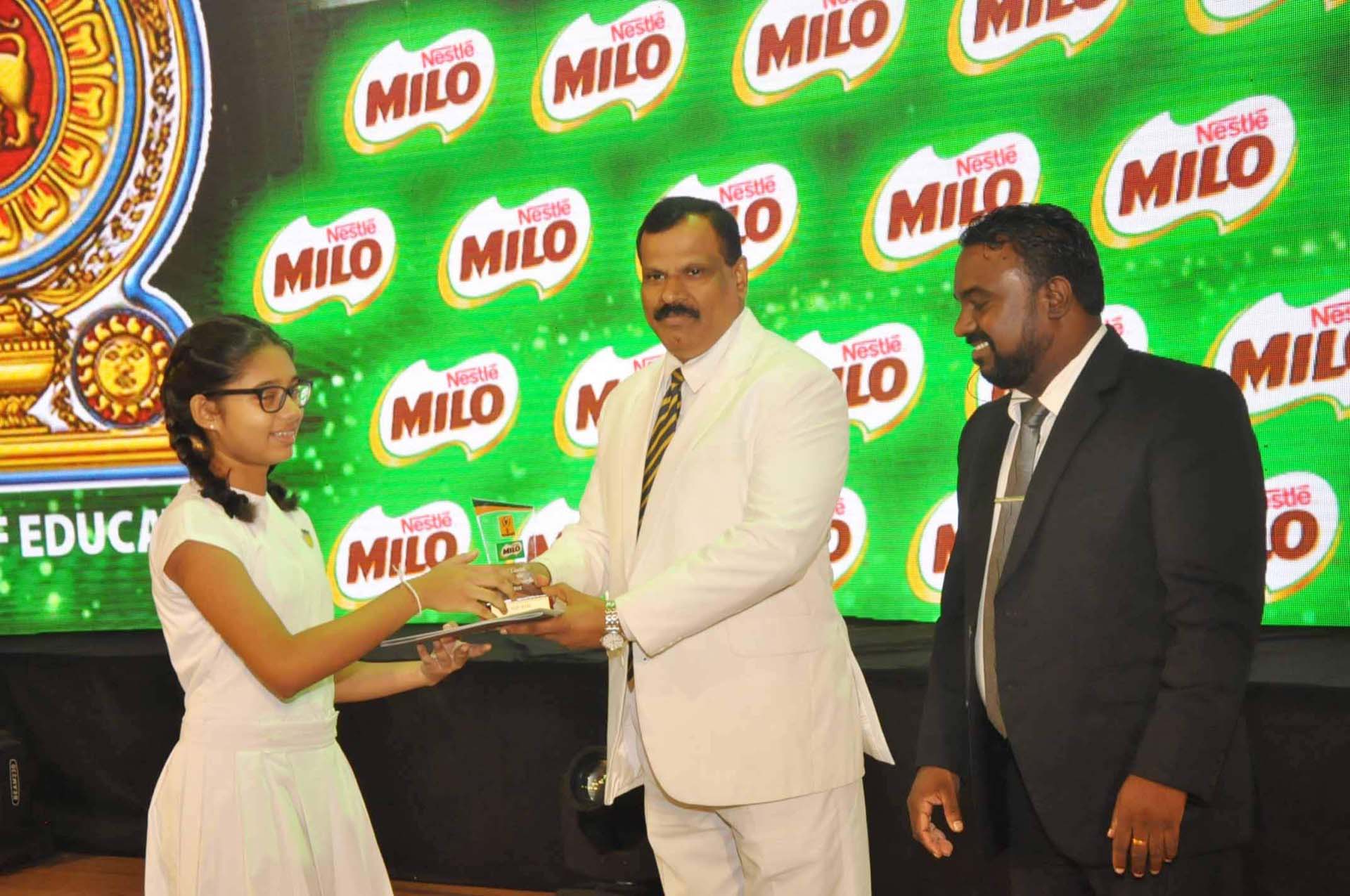 schoolgirl get certificate Milo Colours Awards